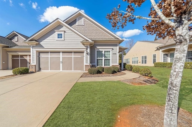 craftsman inspired home featuring a garage and a front yard