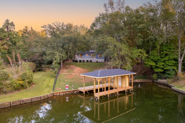 dock area featuring a water view