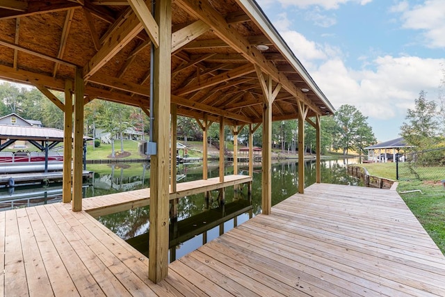 view of dock with a water view and boat lift