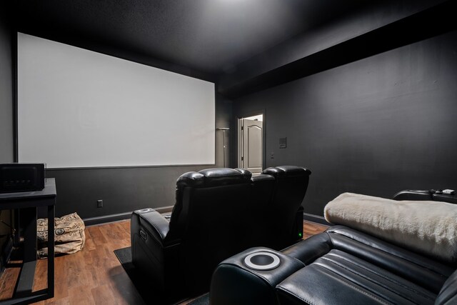 home theater with dark hardwood / wood-style floors