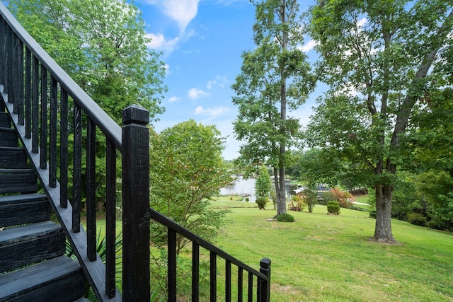 view of yard with a balcony