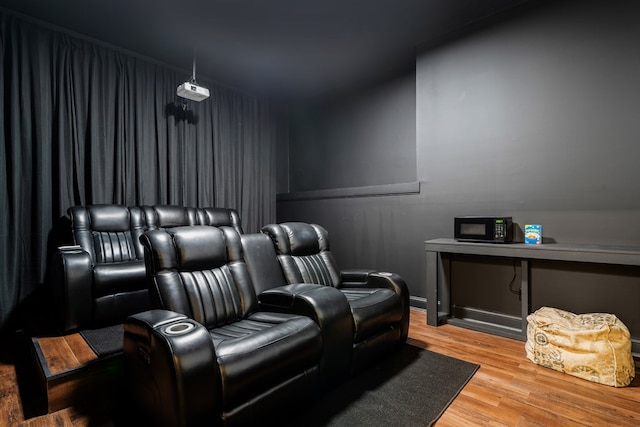 home theater room with hardwood / wood-style flooring