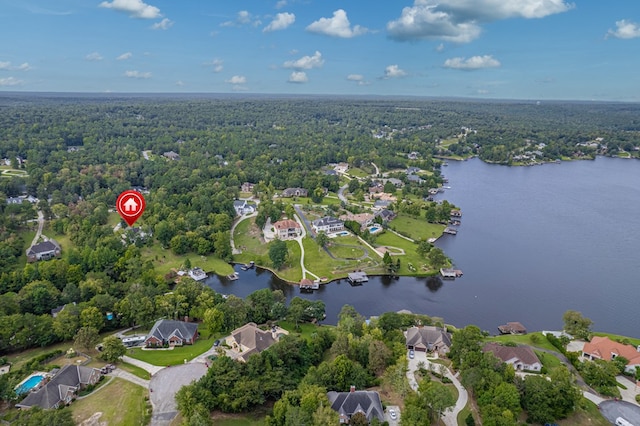 birds eye view of property with a water view