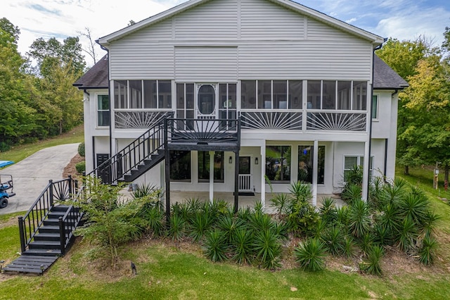 rear view of property featuring a patio