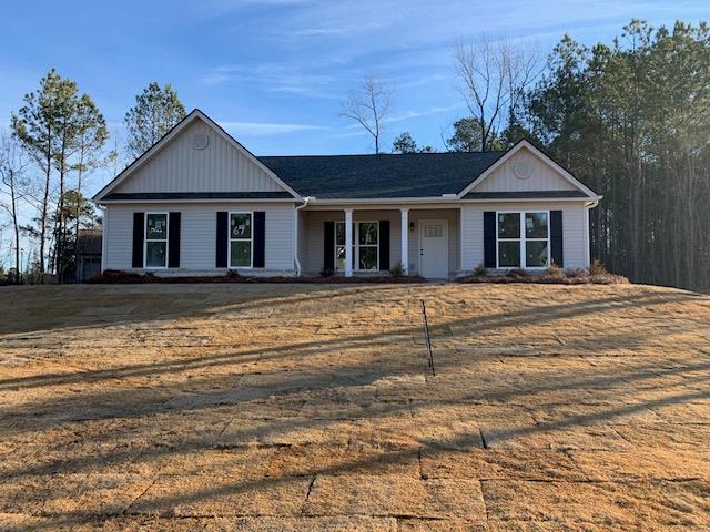 465 Riley Cir, Milledgeville, GA 31061 - view of front of house with covered porch and board and batten siding
