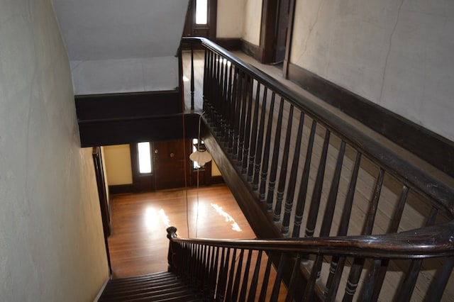 staircase featuring hardwood / wood-style floors