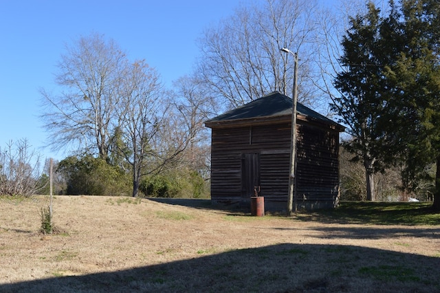 exterior space with a shed