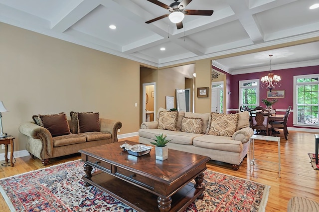 229 Old Plantation Trl, Milledgeville, GA 31061 - living area featuring beam ceiling, baseboards, coffered ceiling, light wood-style flooring, and ceiling fan with notable chandelier