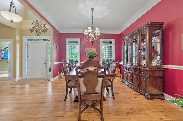 229 Old Plantation Trl, Milledgeville, GA 31061 - dining area with crown molding, baseboards, an inviting chandelier, and light wood-type flooring