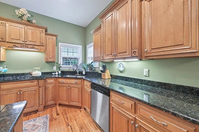 229 Old Plantation Trl, Milledgeville, GA 31061 - kitchen with stainless steel dishwasher, dark stone counters, a sink, light wood-style flooring, and black gas stovetop