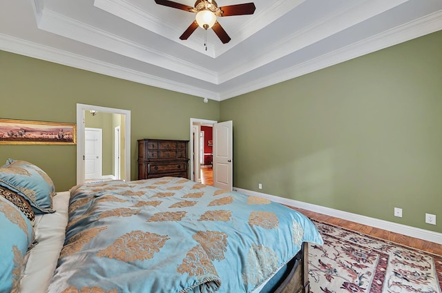 229 Old Plantation Trl, Milledgeville, GA 31061 - bedroom with baseboards, ornamental molding, wood finished floors, and a tray ceiling