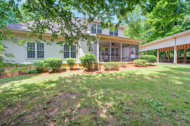 229 Old Plantation Trl, Milledgeville, GA 31061 - rear view of house featuring a lawn, ceiling fan, a shingled roof, and a sunroom