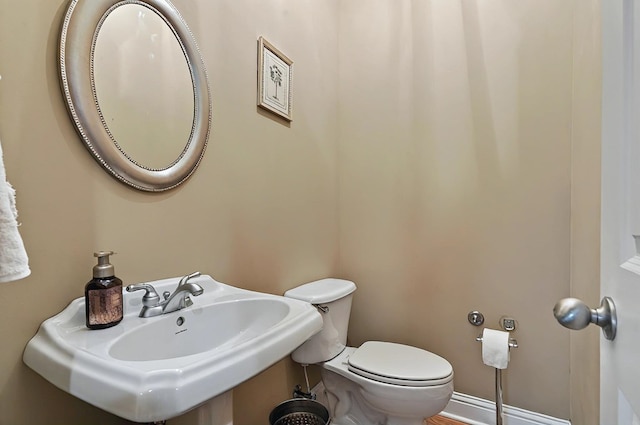 229 Old Plantation Trl, Milledgeville, GA 31061 - half bathroom featuring toilet and a sink