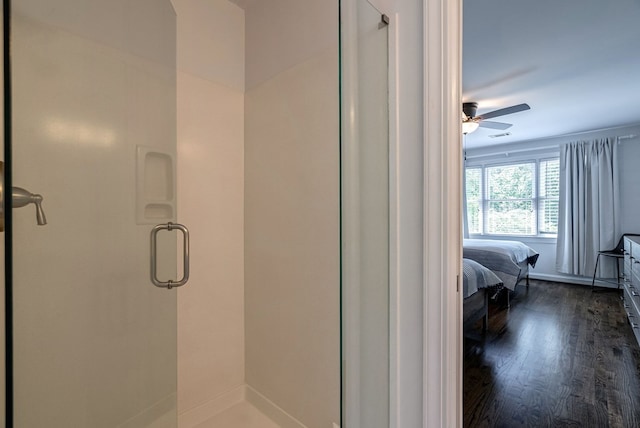 full bath with a stall shower, wood finished floors, a ceiling fan, and connected bathroom