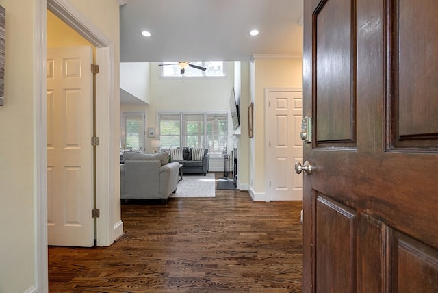 entrance foyer featuring dark wood-type flooring, baseboards, and recessed lighting