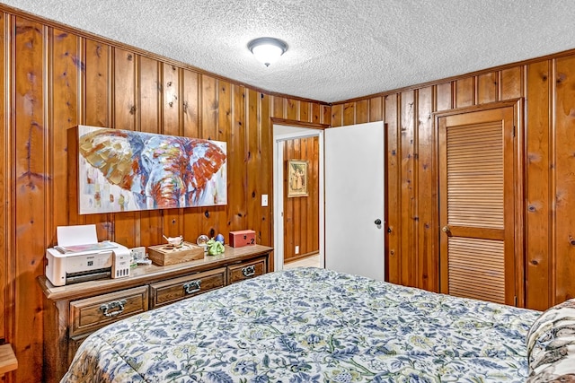 100 Cross Plains Hulett Rd, Carrollton, GA 30016 - bedroom with a closet, a textured ceiling, and wooden walls