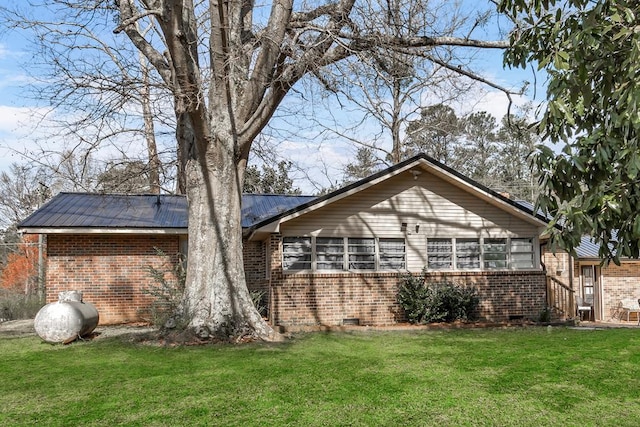 100 Cross Plains Hulett Rd, Carrollton, GA 30016 - view of side of home featuring crawl space, brick siding, and a yard
