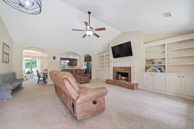 167 NW Old Plantation Trl, Milledgeville, GA 31061 - living area featuring arched walkways, light carpet, vaulted ceiling, ceiling fan, and a fireplace