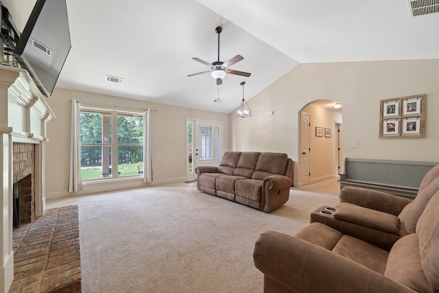 167 NW Old Plantation Trl, Milledgeville, GA 31061 - living room featuring a ceiling fan, arched walkways, lofted ceiling, carpet, and a brick fireplace