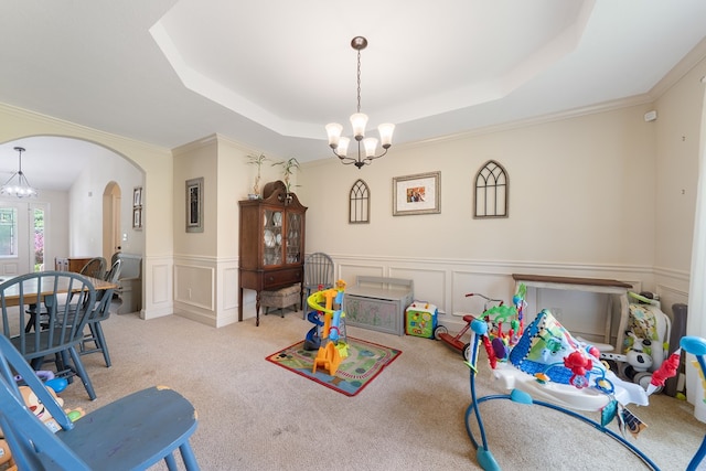 167 NW Old Plantation Trl, Milledgeville, GA 31061 - playroom with a chandelier, arched walkways, a decorative wall, a raised ceiling, and carpet flooring