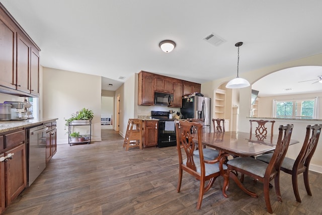167 NW Old Plantation Trl, Milledgeville, GA 31061 - dining room featuring arched walkways, dark wood-type flooring, a ceiling fan, and built in shelves