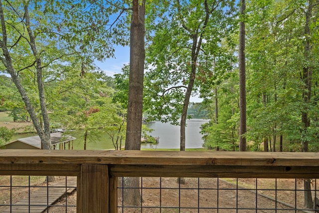 wooden deck featuring a water view