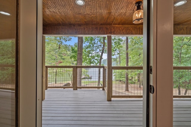 doorway featuring a wealth of natural light and wood ceiling