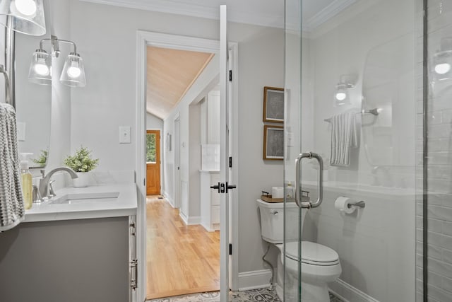 bathroom with toilet, a shower with shower door, hardwood / wood-style flooring, ornamental molding, and vanity