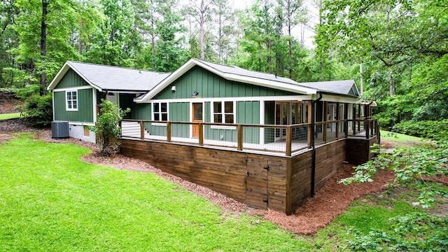 291 Power Point Rd, Milledgeville, GA 31061 - view of front of house featuring a front lawn, central air condition unit, and board and batten siding