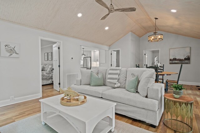 living room featuring lofted ceiling, light hardwood / wood-style flooring, ceiling fan with notable chandelier, and wooden ceiling