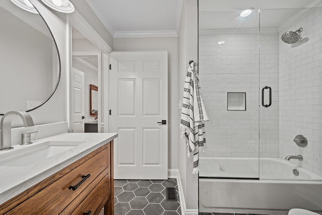 bathroom with tile patterned flooring, crown molding, vanity, and shower / bath combination with glass door