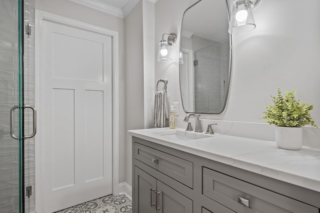 bathroom featuring vanity, a shower with door, and ornamental molding