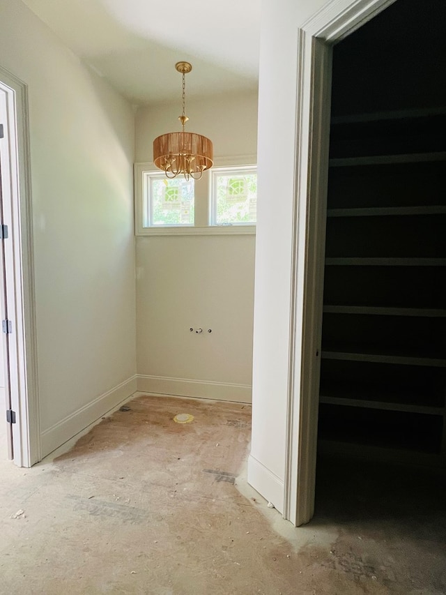 280 Greystone Dr, Milledgeville, GA 31061 - interior space with baseboards and a chandelier