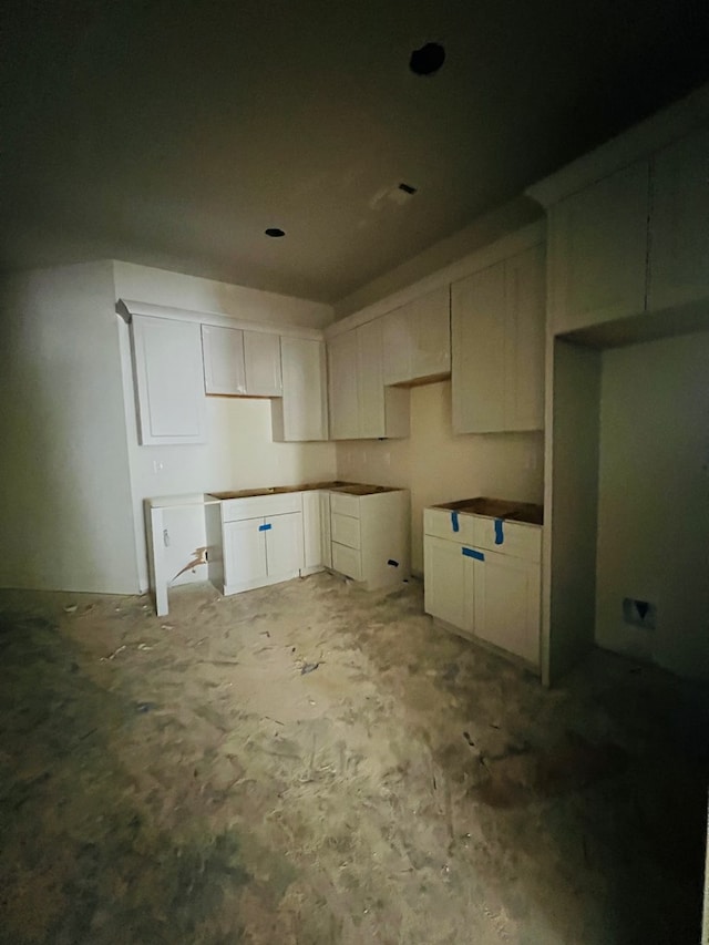280 Greystone Dr, Milledgeville, GA 31061 - kitchen featuring white cabinets and unfinished concrete floors