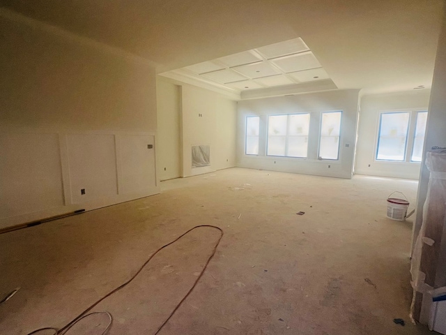 unfurnished room featuring coffered ceiling