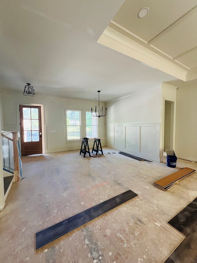 280 Greystone Dr, Milledgeville, GA 31061 - interior space with plenty of natural light, a decorative wall, a notable chandelier, and a wainscoted wall
