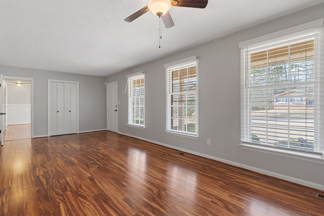 110 Westminster Dr, Eatonton, GA 31024 - unfurnished bedroom with baseboards, visible vents, wood finished floors, and a ceiling fan
