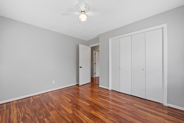 110 Westminster Dr, Eatonton, GA 31024 - unfurnished bedroom with baseboards, a closet, wood finished floors, and a ceiling fan