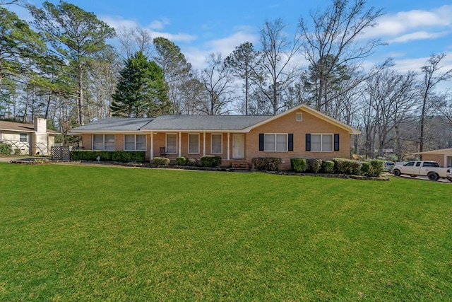 110 Westminster Dr, Eatonton, GA 31024 - ranch-style house with brick siding and a front lawn