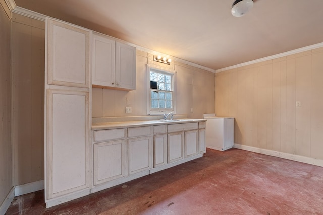 110 Westminster Dr, Eatonton, GA 31024 - kitchen featuring light countertops, concrete flooring, ornamental molding, baseboards, and a sink