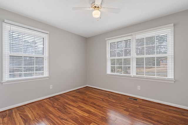 110 Westminster Dr, Eatonton, GA 31024 - spare room featuring baseboards, wood finished floors, and a healthy amount of sunlight