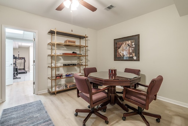 dining area featuring light wood-type flooring and ceiling fan