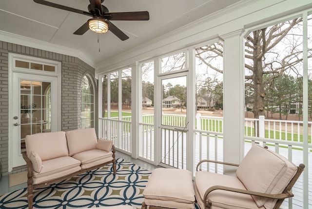 sunroom / solarium with ceiling fan