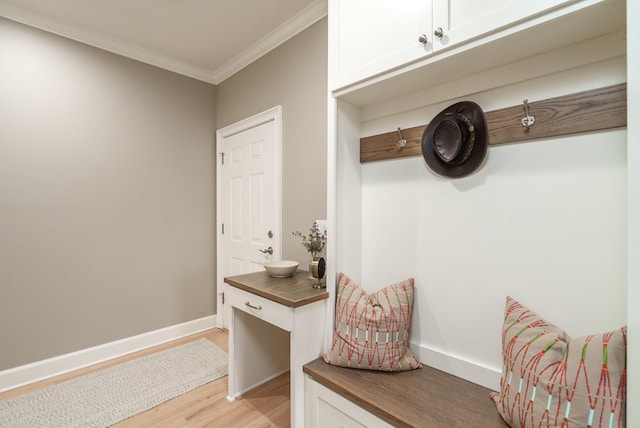 mudroom featuring light hardwood / wood-style floors and ornamental molding