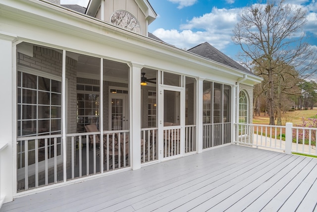 wooden deck featuring a sunroom