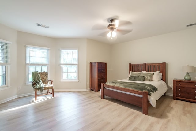 bedroom featuring light hardwood / wood-style floors and ceiling fan