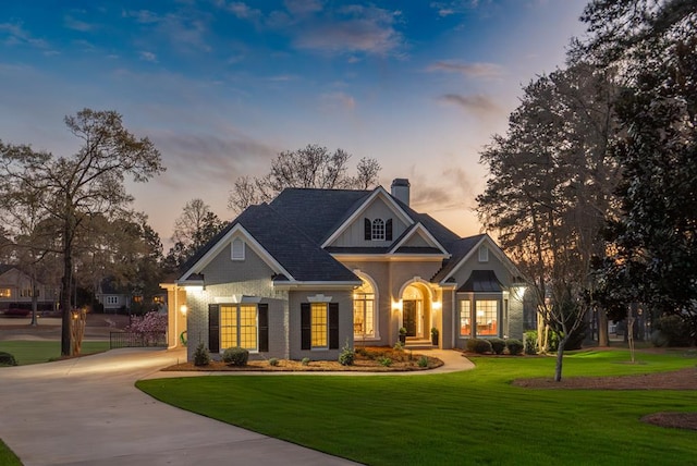 view of front of property with a lawn