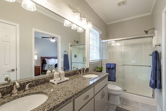 bathroom with vanity, crown molding, tile patterned flooring, ceiling fan, and walk in shower