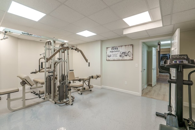 workout room featuring a paneled ceiling