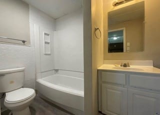 full bathroom with vanity, toilet, and shower / bath combination